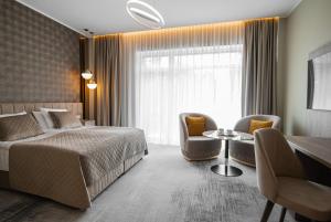 Postel nebo postele na pokoji v ubytování Mineral SPA Draugystė