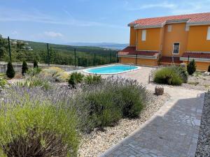 a house with a swimming pool in a garden at Anai Jadranovo in Jadranovo +26 photos