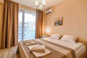 Postel nebo postele na pokoji v ubytování Apart-Hotel Onegin & Thermal Zone