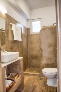 a bathroom with a sink and a toilet at summer paradise stegna rhodes in Archangelos