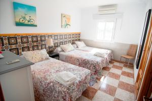 Ένα ή περισσότερα κρεβάτια σε δωμάτιο στο Apartamentos El Palmeral +59 φωτογραφίες