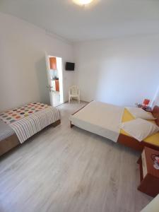 Posteľ alebo postele v izbe v ubytovaní Apartments Berti