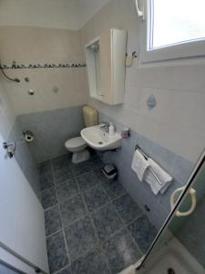 Kúpeľňa v ubytovaní Apartments Berti