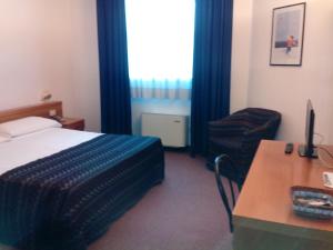 Postel nebo postele na pokoji v ubytování Hotel Niki