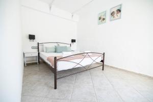 Posteľ alebo postele v izbe v ubytovaní Villa Del Greco