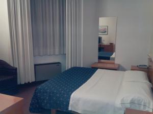 Postel nebo postele na pokoji v ubytování Hotel Niki