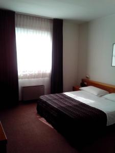 Postel nebo postele na pokoji v ubytování Hotel Niki