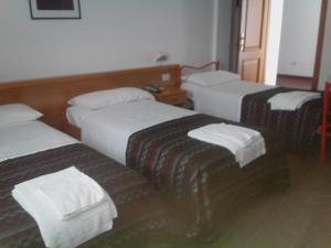 Postel nebo postele na pokoji v ubytování Hotel Niki