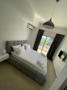 Ένα ή περισσότερα κρεβάτια σε δωμάτιο στο Hotel Mane