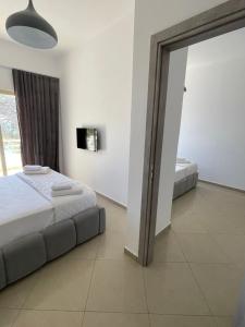 Ένα ή περισσότερα κρεβάτια σε δωμάτιο στο Hotel Mane
