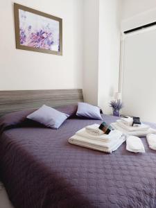 A bed or beds in a room at Butterfly Appartamento