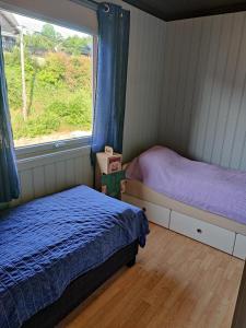 Postel nebo postele na pokoji v ubytování Markveien10 - Koselig og sentrumsnært hus på Grim, Kristiansand