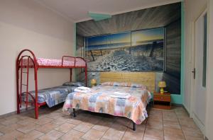 Postel nebo postele na pokoji v ubytování Les Suites Corso Roma