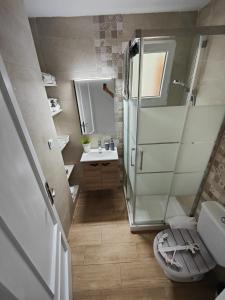 a small bathroom with a shower and a sink at Casa Aigua Blanca Oliva in Oliva