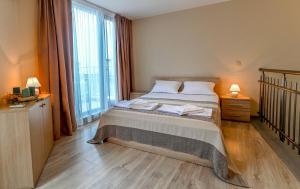 Postel nebo postele na pokoji v ubytování Apart-Hotel Onegin & Thermal Zone