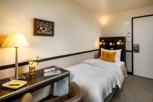 Voodi või voodid majutusasutuse Opera Hotel Zürich toas