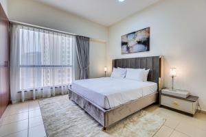 Postel nebo postele na pokoji v ubytování Wonderful apartment near The Beach Sadaf JBR + 36 fotografií