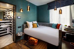 Voodi või voodid majutusasutuse Opera Hotel Zürich toas
