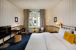 Voodi või voodid majutusasutuse Opera Hotel Zürich toas