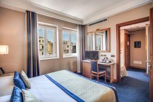 Postel nebo postele na pokoji v ubytování Hotel Diocleziano