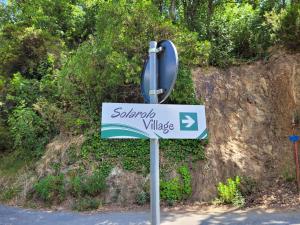 a sign for santa ana village on the side of a hill at Solarolo Village in Moneglia