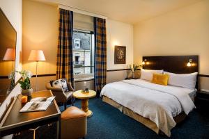 Voodi või voodid majutusasutuse Opera Hotel Zürich toas