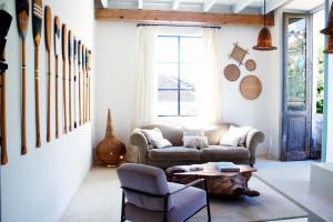 a living room with a couch and a table at SAMAMBAIA in Rio de Janeiro