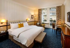Voodi või voodid majutusasutuse Opera Hotel Zürich toas