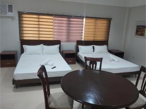 Ένα ή περισσότερα κρεβάτια σε δωμάτιο στο OYO 881 Nest Suites