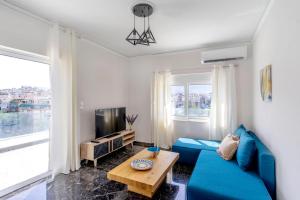 A television and/or entertainment centre at Penthouse in the heart of Athens / Koukaki area
