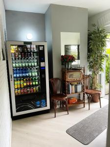 a refrigerator filled with lots of drinks in a room at Victoria Royal Garden in Como