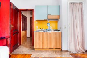 a kitchen with a sink and a counter top at Guesthouse Ava in Rovinj