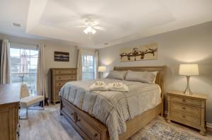 a bedroom with a bed with two towels on it at Pooler Travelers Retreat V - Entire House - in Savannah