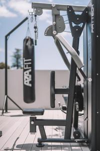 a punching bag in a gym with a boxing glove at QUINTA TORRINHA LUXODREAM Apartment in Funchal