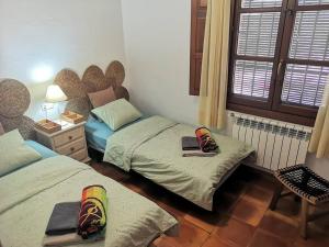 Łóżko lub łóżka w pokoju w obiekcie Domicilio de Vida