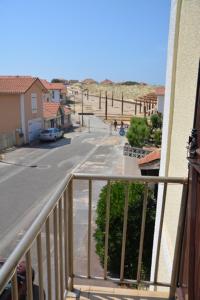 a view of a street from a balcony of a building at Appartement 4 personnes Vieux-Boucau in Vieux-Boucau-les-Bains