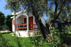 A garden outside Holiday Apartment orchidea with swimming pool and private beach -3