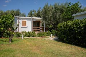 A garden outside Holiday Apartment orchidea with swimming pool and private beach -3