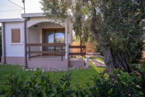A garden outside Holiday Apartment orchidea with swimming pool and private beach -3