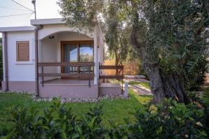 A garden outside Holiday Apartment orchidea with swimming pool and private beach -3