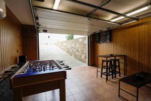 a room with a giant chess board on the floor at Villa Albino Piscina climatizada in Ribas del Sil