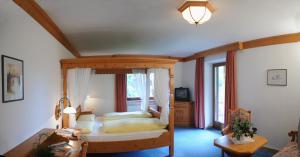 Säng eller sängar i ett rum på Sport Hotel Wildgall