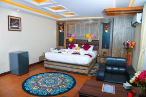 Rúm í herbergi á Hotel Airport Deepshree