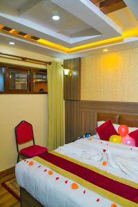 Rúm í herbergi á Hotel Airport Deepshree