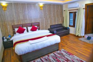 Rúm í herbergi á Hotel Airport Deepshree