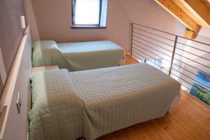 A bed or beds in a room at Le Giustizie