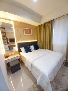 Ένα ή περισσότερα κρεβάτια σε δωμάτιο στο The Nove Apartment Kaina Tower