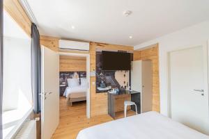Voodi või voodid majutusasutuse Esplanade Hotel toas