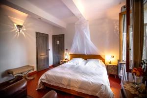 Säng eller sängar i ett rum på Le Mas des Romarins