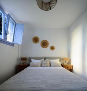 Ліжко або ліжка в номері Antiparos Luxury Villas